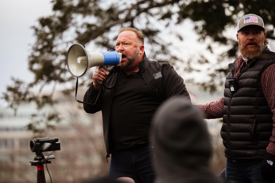 Alex Jones, the founder of right-wing media group Infowars, addresses a crowd of pro-Trump protesters after they stormed the U.S. Capitol on Jan. 6, 2021.