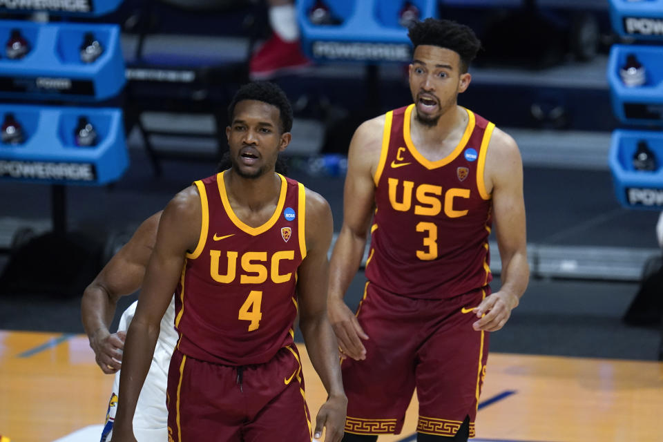 USC forward Evan Mobley (4) and Isaiah Mobley (3) watch against Kansas during the second half of a men's college basketball game in the second round of the NCAA tournament at Hinkle Fieldhouse in Indianapolis, Monday, March 22, 2021. (AP Photo/Paul Sancya)