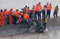 A survivor is rescued by divers from the Dongfangzhixing vessel which sank in the Yangtze river, Hubei province, on June 2, 2015