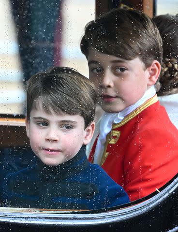 <p>Finnbarr Webster/Getty</p> (From left) Prince Louis and Prince George look out of a window of a carriage following the coronation on May 6, 2023.