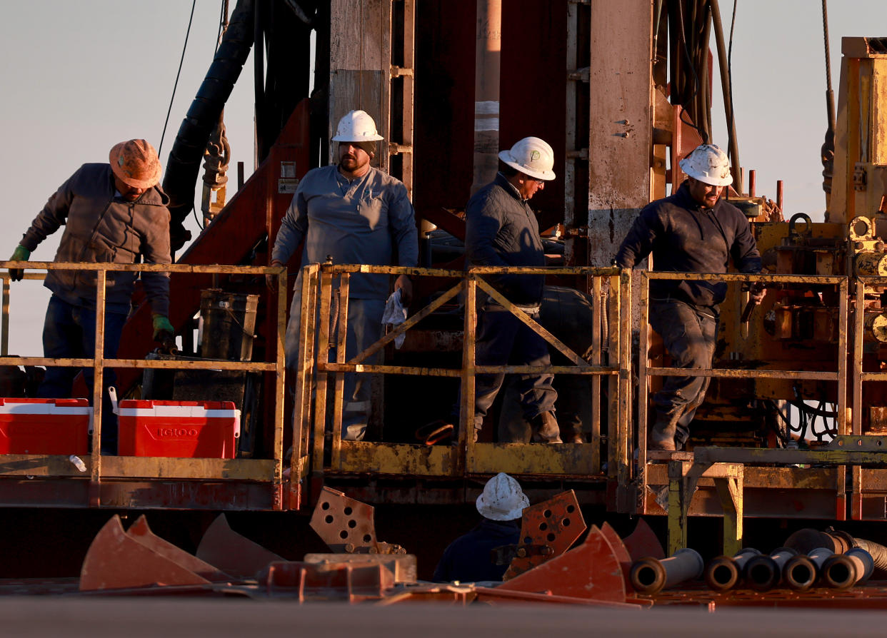 STANTON, TEXAS - MARCH 12: Workers on an oil drilling rig setup in the Permian Basin oil field on March 12, 2022 in Stanton, Texas.  United States President Joe Biden imposed a ban on Russian oil, the world’s third-largest oil producer, which may mean that oil producers in the Permian Basin will need to pump more oil to meet demand. The Permian Basin is the largest petroleum-producing basin in the United States. (Photo by Joe Raedle/Getty Images)