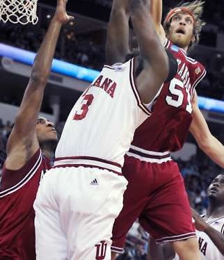 Indiana’s D.J. White has his shot blocked by Arkansas’ Steven Hill (51) during the first half of Friday night’s first-round NCAA Tournament game at the RBC Center in Raleigh, N.C. The Hoosiers lost to the Razorbacks, 86-72.Chris Howell | Herald-Times