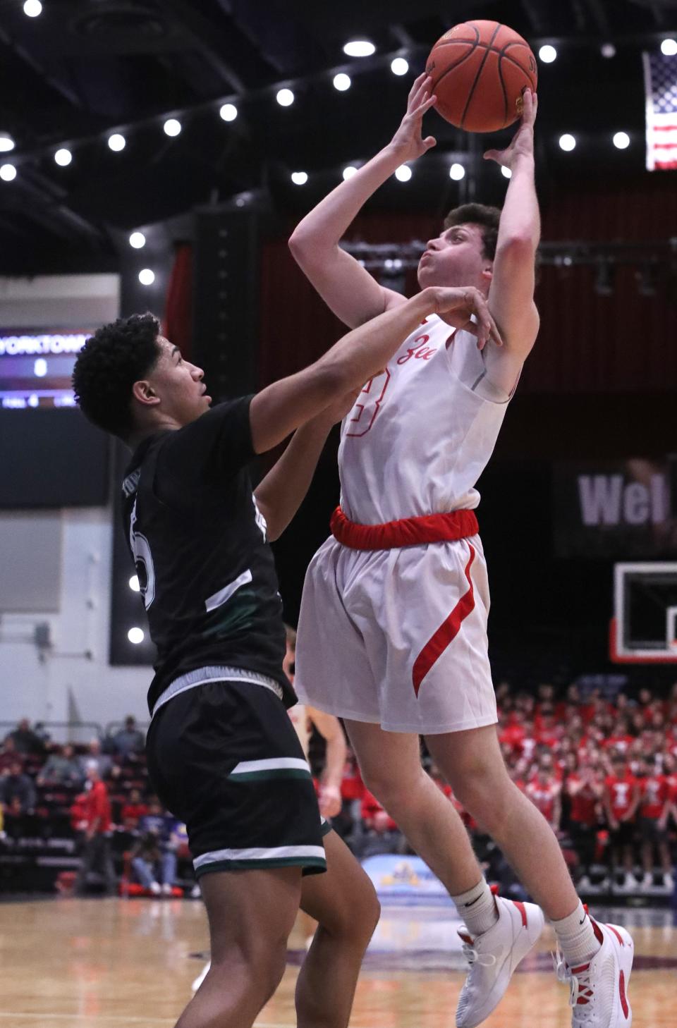 Tappan Zee's Jack Maloney shoots over Yorktown's Justin Price during a Class A semifinal at the Westchester County Center Mar. 2, 2023.