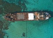 An aerial view of BRP Sierra Madre, a 100-metre ship built for the US in 1944, grounded at Second Thomas Shoal in the Spratly Islands. A handful of marines living on a World War II-era ship that is grounded on a remote, tiny reef is the Philippines' last line of defence against China's efforts to control most of the South China Sea