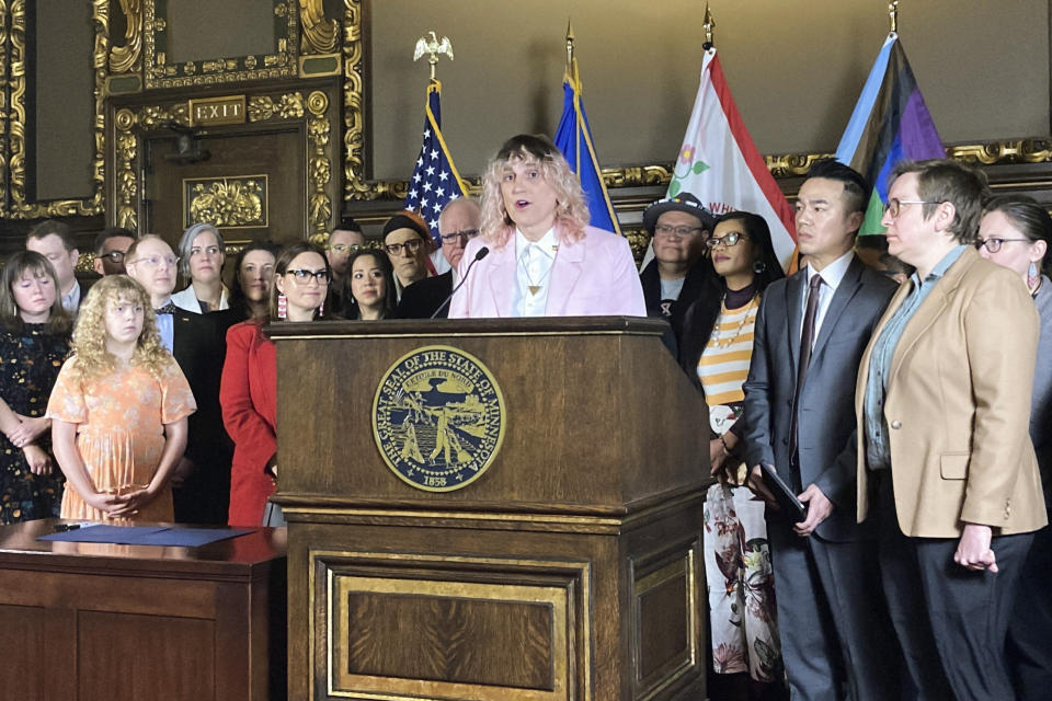 Democratic Minnesota state Rep. Leigh Finke, of St. Paul, the state's first openly transgender legislator, speaks at a ceremony before Democratic Gov. Tim Walz signs an executive order on Wednesday, March 8, 2023, at the State Capitol in St. Paul, Minn., to protect the rights of LGBTQ people from Minnesota and other states to receive gender affirming health care. (AP Photo/Steve Karnowski)