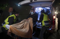 Former Palestinian prisoner Khaled Fasfous is taken out of an ambulance at the tomb of Palestinian leader Yasser Arafat, in the West Bank city of Ramallah, Sunday, Dec. 5, 2021. Israel released Fasfous, two weeks after striking a deal that ended his marathon 131-day hunger strike. Fasfous was the symbolic figurehead of six hunger strikers protesting Israel’s controversial policy of “administrative detention” that allows suspects to be held indefinitely without charge for months and even years (AP Photo/Majdi Mohammed)