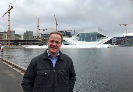 Stig Bakke poses for a picture in Oslo, Norway March 20, 2017. Bakke, a 52-year-old civil servant married to a Danish woman, was looking forward to teasing his relatives. "That's of course something I will use when I go down to visit them this Easter, saying them that they're number two," he said. REUTERS/Lefteris Karagiannopoulos