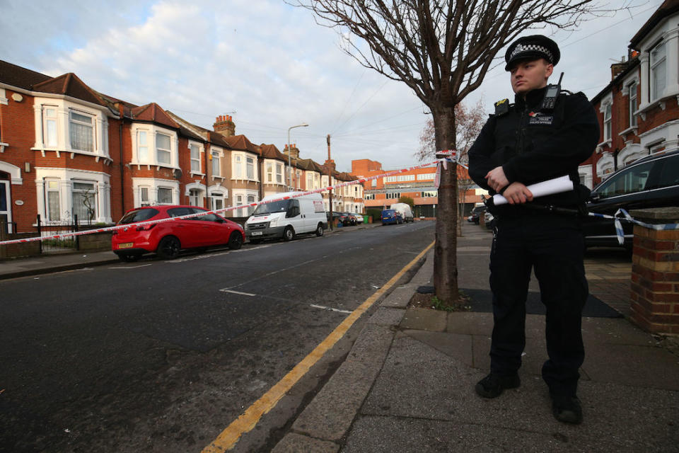 A police officer at the scene on Elmstead Road in Seven Kings, Ilford, east London, where three people died after being stabbed Sunday evening. Two men, aged 29 and 39, have been arrested by the Metropolitan Police on suspicion of murder. PA Photo. Picture date: Monday January 20, 2020. See PA story POLICE Ilford . Photo credit should read: Jonathan Brady/PA Wire