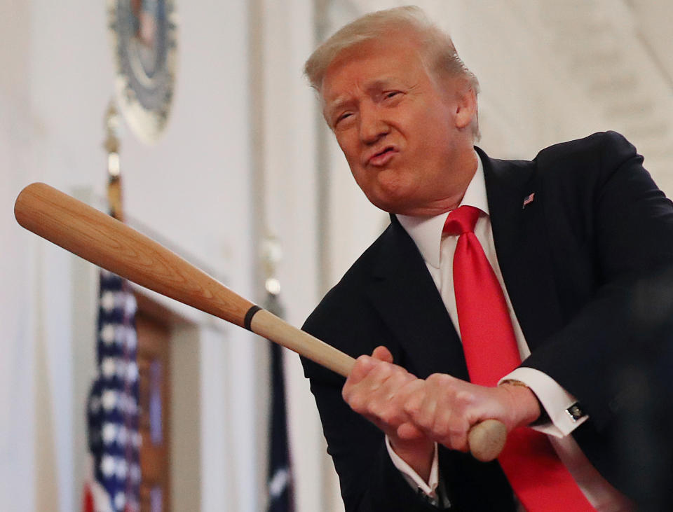 WASHINGTON, DC - JULY 02: U.S. President Donald Trump holds a baseball bat while looking at exhibits during a Spirit of America Showcase in the Entrance Hall of the White House July 02, 2020 in Washington, DC. The president visited with representatives from invited companies like Weber-Stephen Products, the Texas Timber Wood Bat Company, Scars & Stripes Coffee, Carolina Pie, Fruit of the Earth, Nautilus Fishing Company and others. (Photo by Chip Somodevilla/Getty Images)