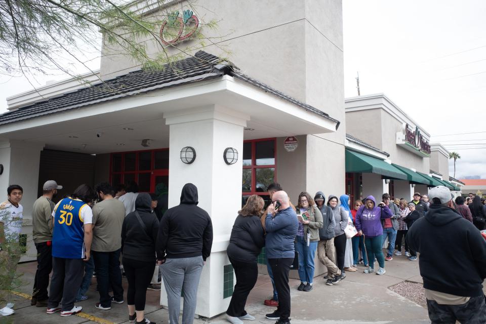 The line of people wraps around the Sweet Tomatoes restaurant on April 1, 2024, as customers wait to eat at the restaurant for the first time in approximately four years.