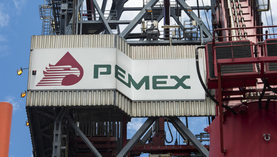 The PEMEX logotype on the tower of the drilling tower of La Muralla IV exploration oil rig, operated by Mexican company "Grupo R" and working for Mexico's state-owned oil company  PEMEX, in the Gulf of Mexico on August 30, 2013. The semisubmersible platform is able to drill to a depth of 10.000 meters in an enviroment such as the Gulf of Mexico.    AFP PHOTO/OMAR TORRES        (Photo credit should read OMAR TORRES/AFP via Getty Images)