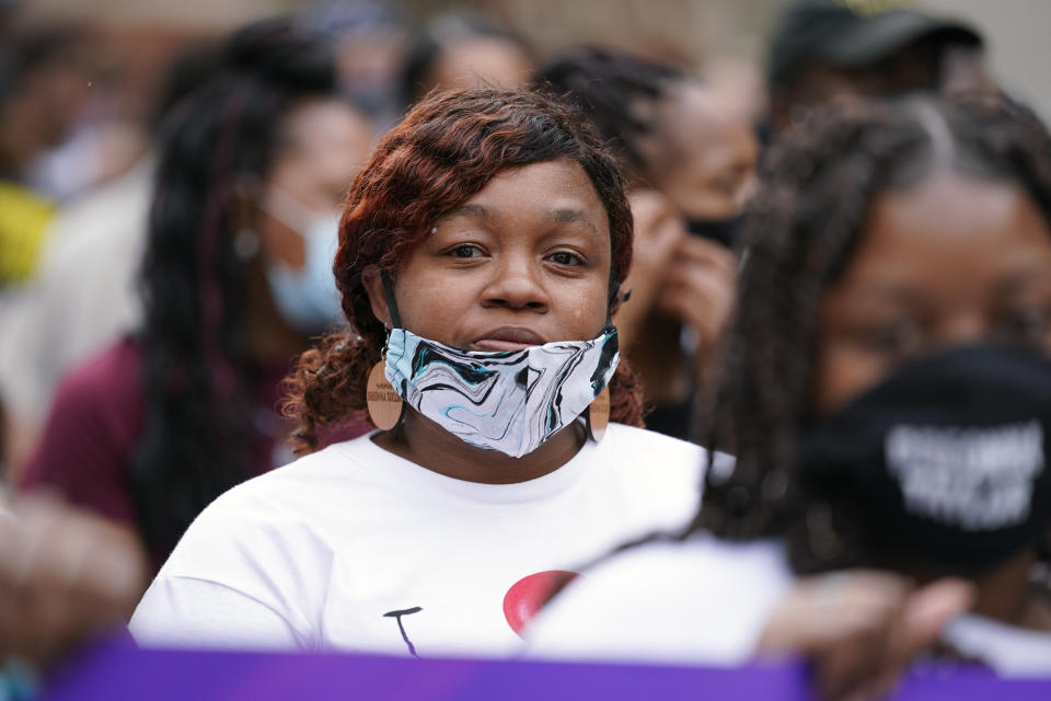 Tamika Palmer, the mother of Breonna Taylor, marches with Black Lives Matter protesters, Friday, Sept. 25, 2020, in Louisville. Breonna Taylor's family demanded Friday that Kentucky authorities release all body camera footage, police files and the transcripts of the grand jury hearings that led to no charges against police officers who killed the Black woman during a March drug raid at her apartment. (AP Photo/Darron Cummings)