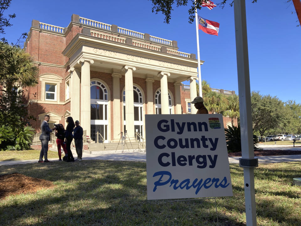 Black and white pastors have set up a tent and are asking for prayers during the trial over the death of Ahmaud Arbery at the Glynn County courthouse in Brunswick, Georgia, on Tuesday, Nov. 16, 2021. A call by a defense attorney to kick Black pastors out of the courtroom angered the community. (AP Photo/Jeffrey Collins)