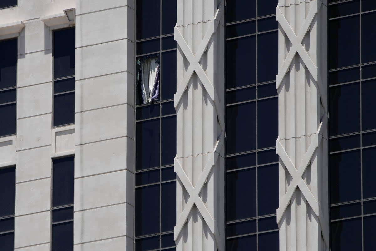 A curtain hangs out of a broken window on a hotel tower at Caesars Palace Hotel & Casino, Tuesday, July 11, 2023, in Las Vegas (Copyright 2023 The Associated Press. All rights reserved.)