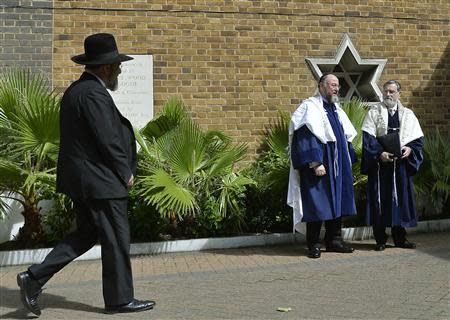 Chief rabbi, Jonathan Sacks (R), and chief rabbi-designate, Ephraim Mirvis (2nd R), wait for Prince Charles to arrive to attend the installation of Mirvis as chief rabbi, at St John's Wood Synagogue in London September 1, 2013. REUTERS/Toby Melville