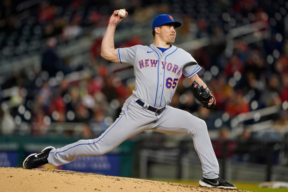 New York Mets relief pitcher Trevor May throws a pitch to the Washington Nationals during the sixth inning of an opening day baseball game at Nationals Park, Thursday, April 7, 2022, in Washington.