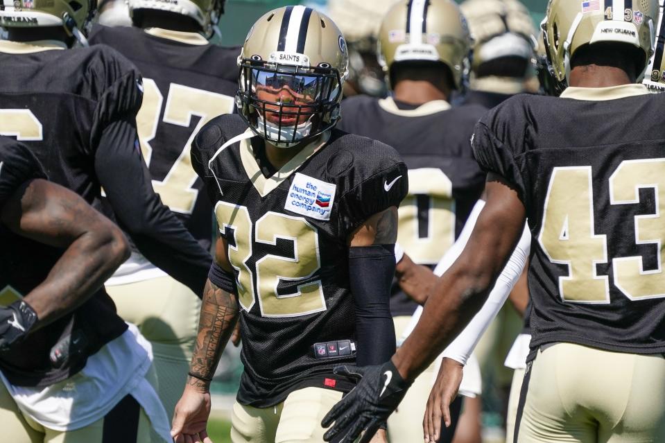 New Orleans Saints' Tyrann Mathieu stretches before an NFL football joint practice session with the Green Bay Packers Tuesday, Aug. 16, 2022, in Green Bay, Wis. (AP Photo/Morry Gash)