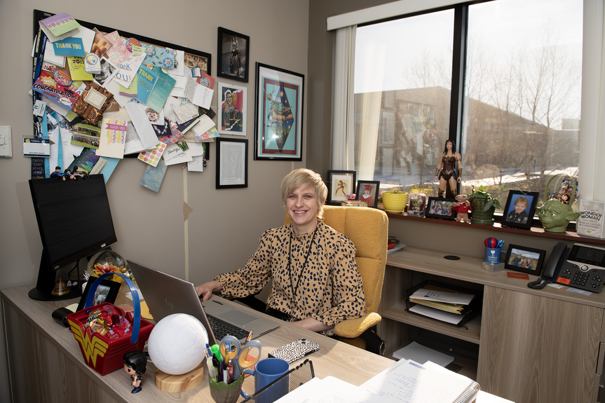 Executive Director Cindy Brew sits at her desk in the expanded Children's Advocacy Center at UH Portage Medical Center in Ravenna.