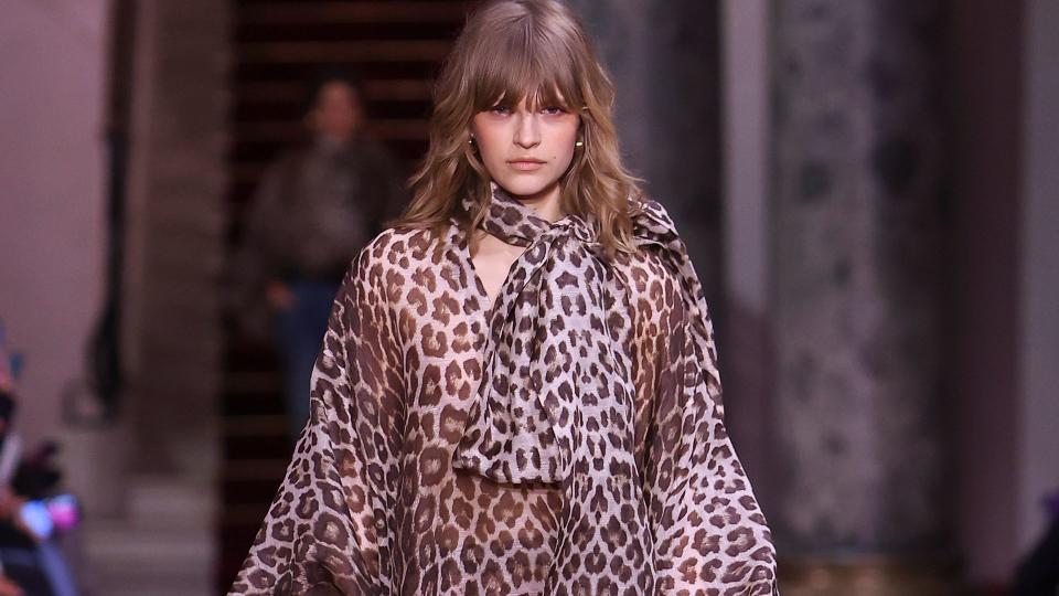 A model walks the runway during the Zimmermann Ready to Wear Fall/Winter 2024-2025 fashion show in a leopard print dress