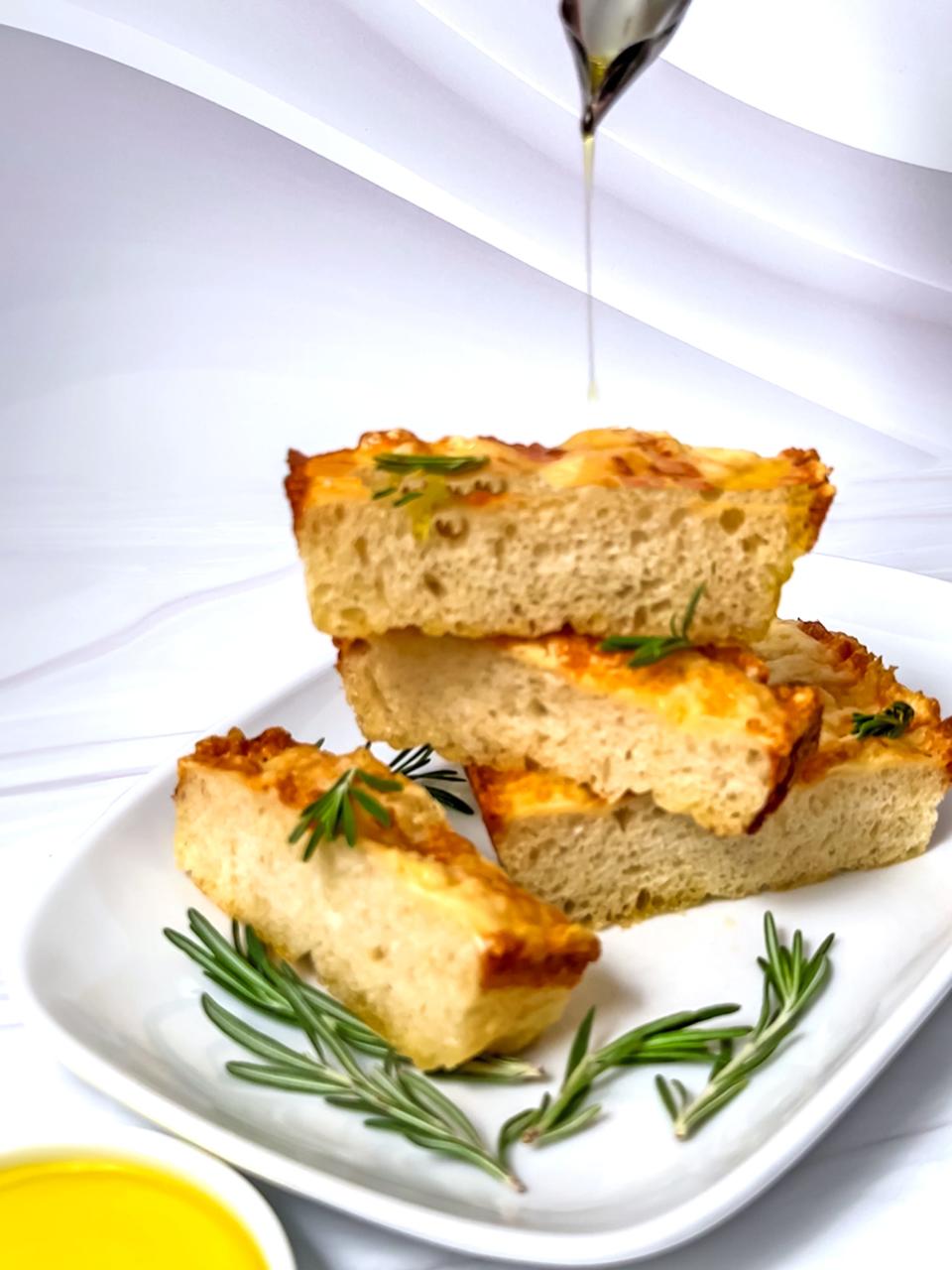 Easy Cheese No-Knead Mini Focaccia is topped with shredded mozzarella cheese and Parmesan cheese.
