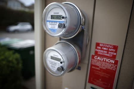 Dual electricity meters are seen outside of computer science professor Christa Lopes' home in Irvine, California January 26, 2015. REUTERS/Lucy Nicholson