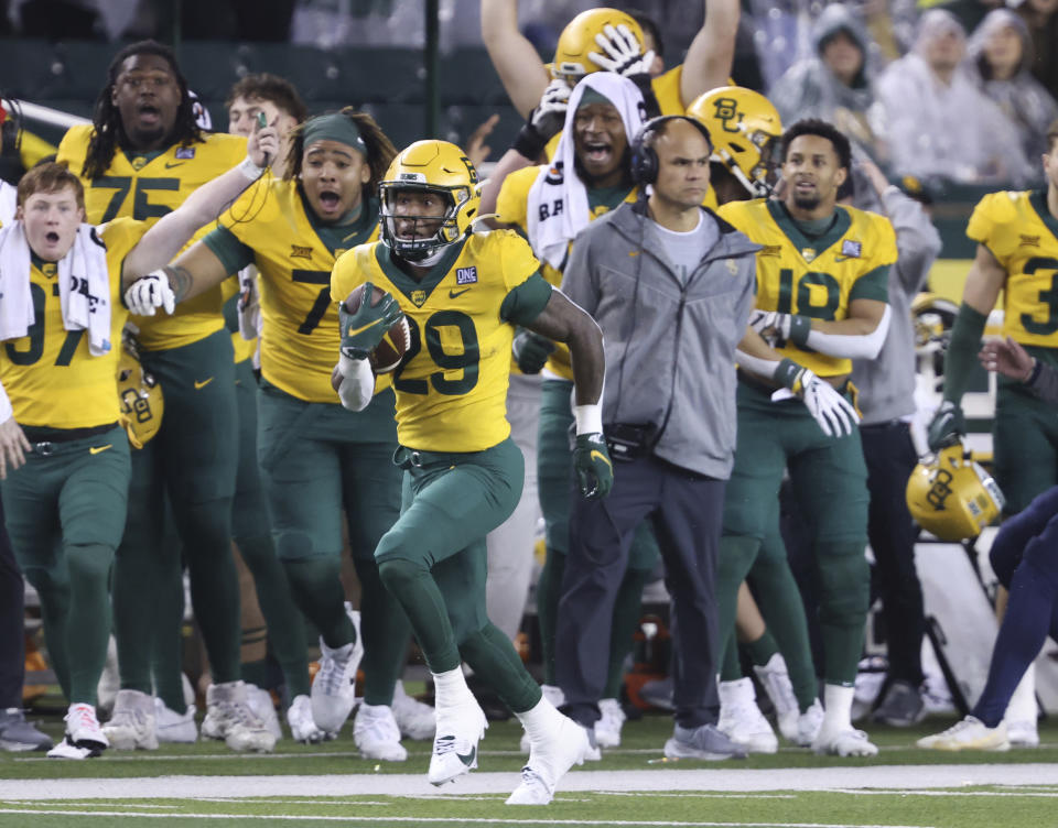 Baylor running back Richard Reese (29) runs back a 93-yard kickoff return against West Virginia in the first half of an NCAA college football game, Saturday, Nov. 25, 2023, in Waco, Texas. (Rod Aydelotte/Waco Tribune-Herald, via AP)