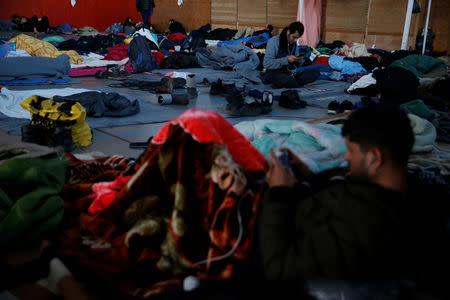 Kurdish migrants from Irak rest inside a gymnasium in Grande-Synthe, France, January 9, 2019. Picture taken January 9, 2019. REUTERS/Pascal Rossignol