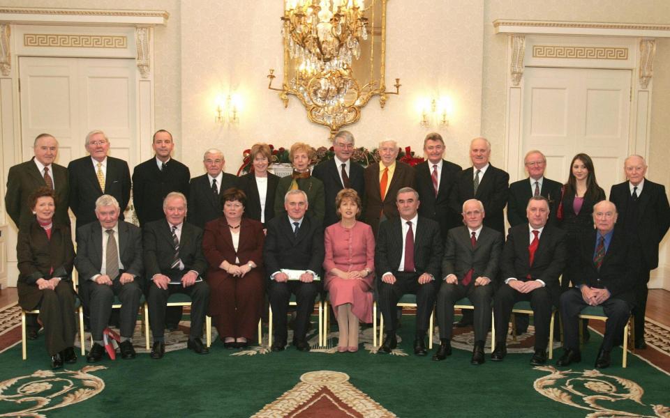 Murray, fourth right, front row, next to the Irish president Mary McAleese, with fellow members of the Council of State in 2004 - AFP via Getty Images