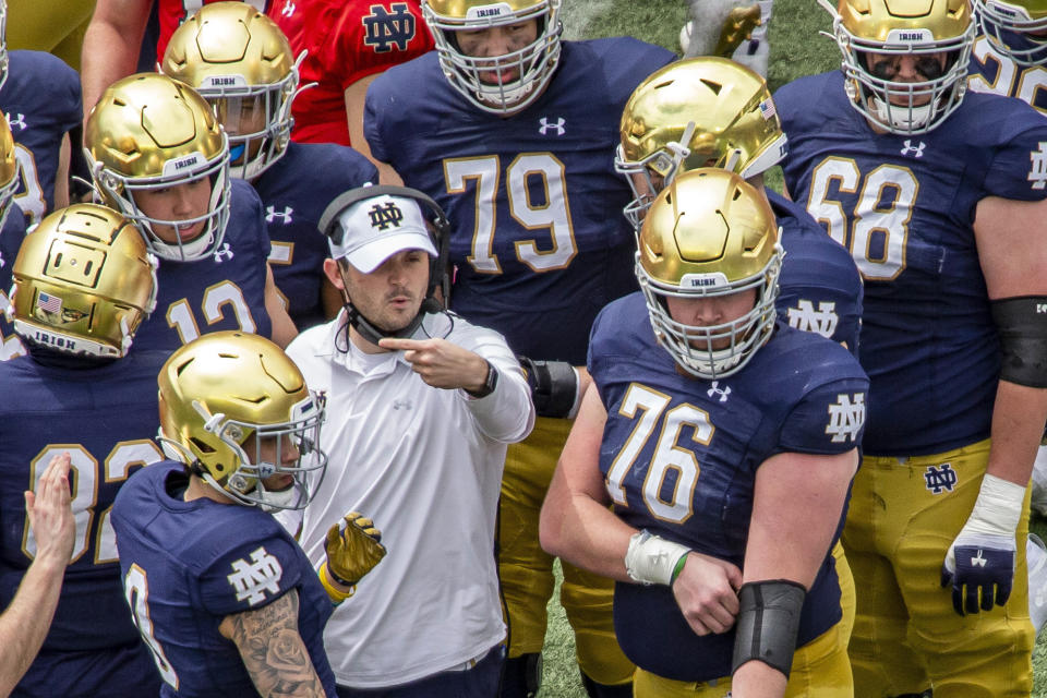 FILE - Notre Dame offensive coordinator Tommy Rees talks with players during a timeout in the Blue-Gold NCAA spring football game on May 1, 2021, in South Bend, Ind. Rees has spoken with Alabama coach Nick Saban about filling a vacancy on the Crimson Tide's coaching staff and was scheduled to be in Tuscaloosa on Thursday, Feb. 2, 2023, two people familiar with the situation told The Associated Press. (AP Photo/Robert Franklin, File)