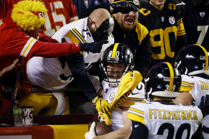 Pittsburgh Steelers outside linebacker T.J. Watt, center, celebrates with fans after returning a fumble for a touchdown during the first half of an NFL wild-card playoff football game against the Kansas City Chiefs, Sunday, Jan. 16, 2022, in Kansas City, Mo. (AP Photo/Colin E. Braley)