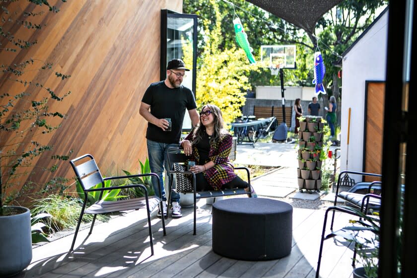 Michael Cosentino and his wife, Rion Nakaya on the deck that sits between the main house and the ADU.