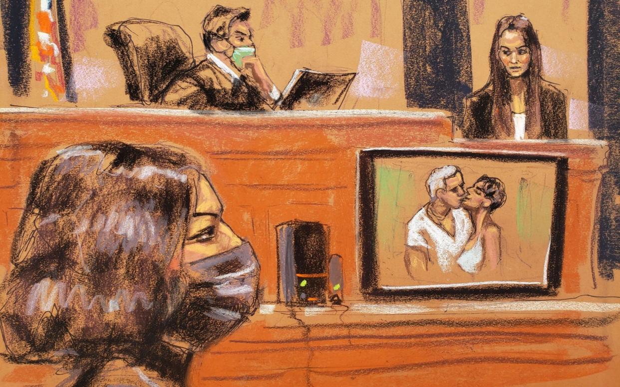 A photo of Ghislaine Maxwell and Jeffrey Epstein is shown as FBI analyst Kimberly Meder testifies during Maxwell's sex trafficking trial - JANE ROSENBERG/REUTERS