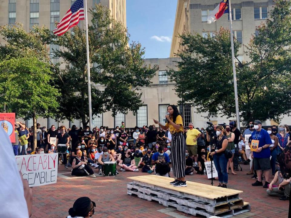 A speech is given at the start of the candlelight vigil and march in Durham on Thursday, June 4, 2020, as part of #OccupyBlackWallStreet hosted by graduating high school seniors Aissa Dearing and Elijah King, co-founder of Durham Free Lunch and a local youth organizer.