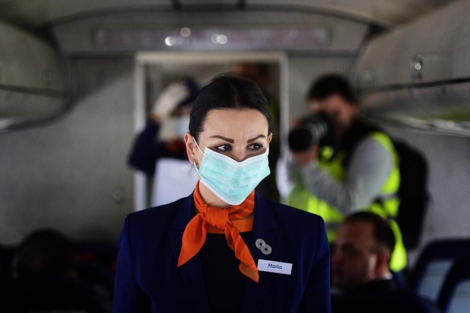 Put on your mask first before assisting others.  (Yuri Smityuk via Getty Images)