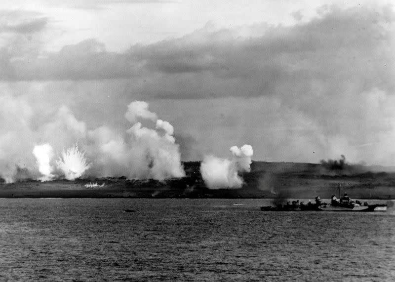 White phosphorus rounds burst ashore during the pre-invasion bombardment of the island of Iwo Jima