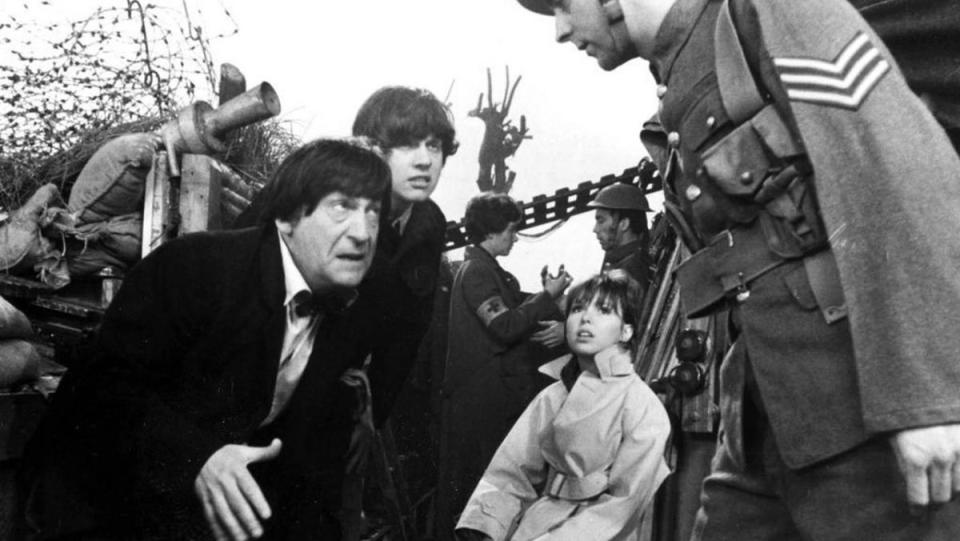 The Doctor, Jamie, and Zoe are surrounded by WWI soldiers in the historical-adjacent story "The War Games."