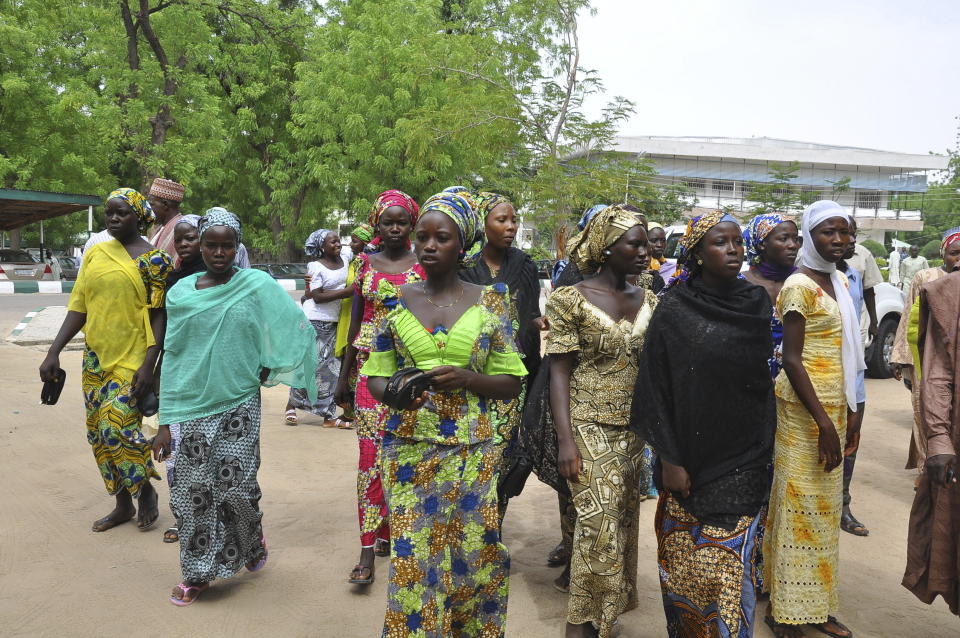 FILE - Some of the escaped kidnapped girls of the government secondary school Chibok arrive for a meeting with Borno state governor, in Maiduguri, Nigeria, Monday June, 2. 2014. Their experience represents a worrying new development in Nigeria, Africa's most populous country where the mass abduction of Chibok schoolgirls a decade ago marked a new era of fear even as nearly 100 of the girls remain in captivity. An array of armed groups now focus on abducting schoolchildren, seeing in them a lucrative way to fund other crimes and control villages in the nation's mineral-rich but poorly-policed northwestern region. (AP Photo/Jossy Ola, File)