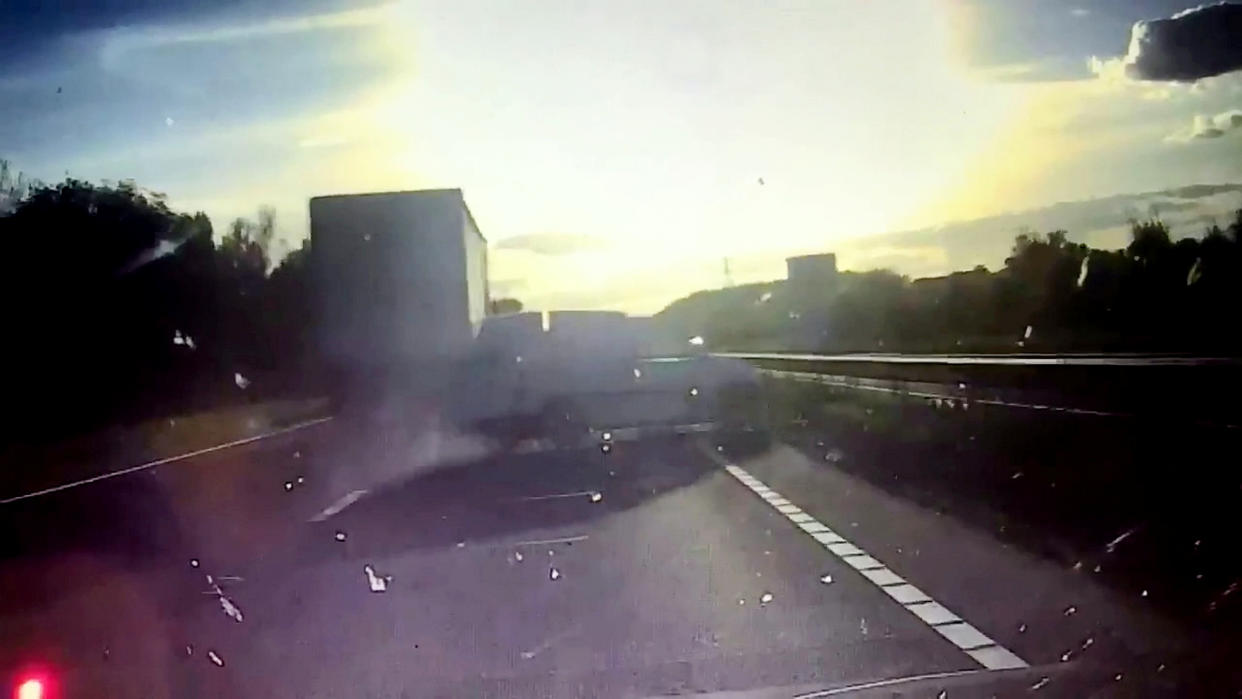 <em>The van bounces off the lorry and skids across the road into the central reservation (Picture: SWNS)</em>