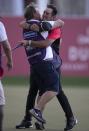 Australia's Lucas Herbert celebrates with his caddie after he won the Dubai Desert Classic golf tournament in Dubai, United Arab Emirates, Sunday, Jan. 26, 2020. (AP Photo/Kamran Jebreili)