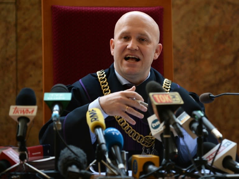 Judge Dariusz Mazur announces the decision of Krakow's regional court in the trial of Oscar-winning director Roman Polanski at the regional court in Krakow on October 30, 2015