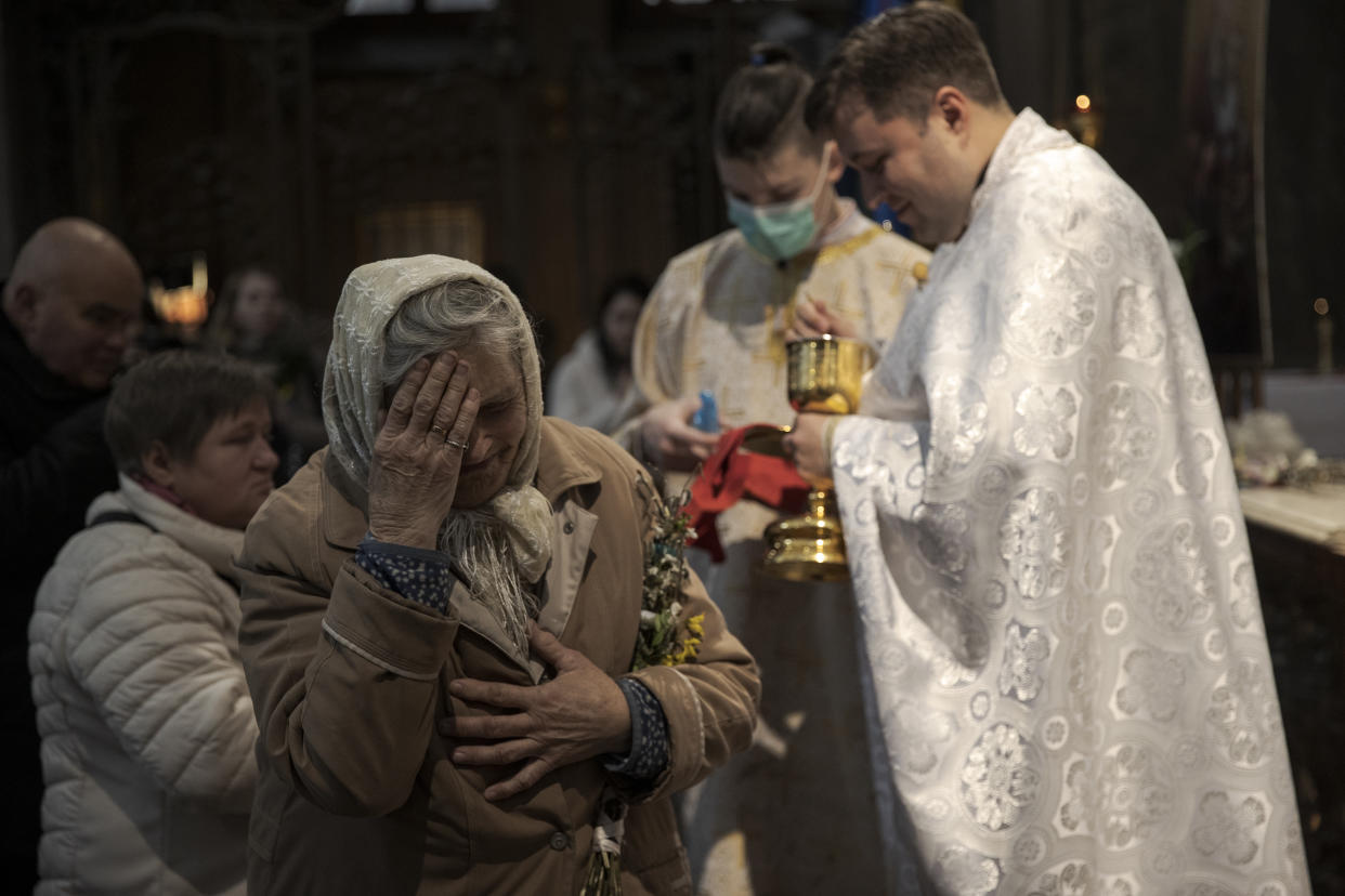 Worshippers attend an Orthodox Palm Sunday mass.