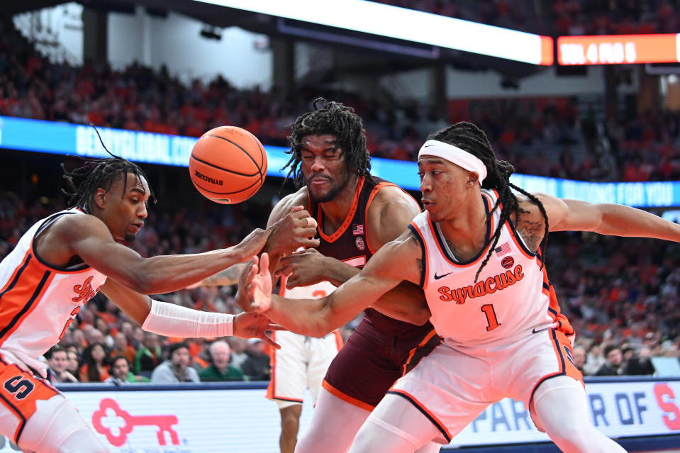 Feb 27, 2024; Syracuse, New York, USA; Syracuse Orange forward Maliq Brown (1) and guard <a class="link " href="https://sports.yahoo.com/ncaab/players/169536/" data-i13n="sec:content-canvas;subsec:anchor_text;elm:context_link" data-ylk="slk:JJ Starling;sec:content-canvas;subsec:anchor_text;elm:context_link;itc:0">JJ Starling</a> (2) strip the ball from Virginia Tech Hokies forward Mylyjael Poteat in the first half at the JMA Wireless Dome. Mark Konezny-USA TODAY Sports