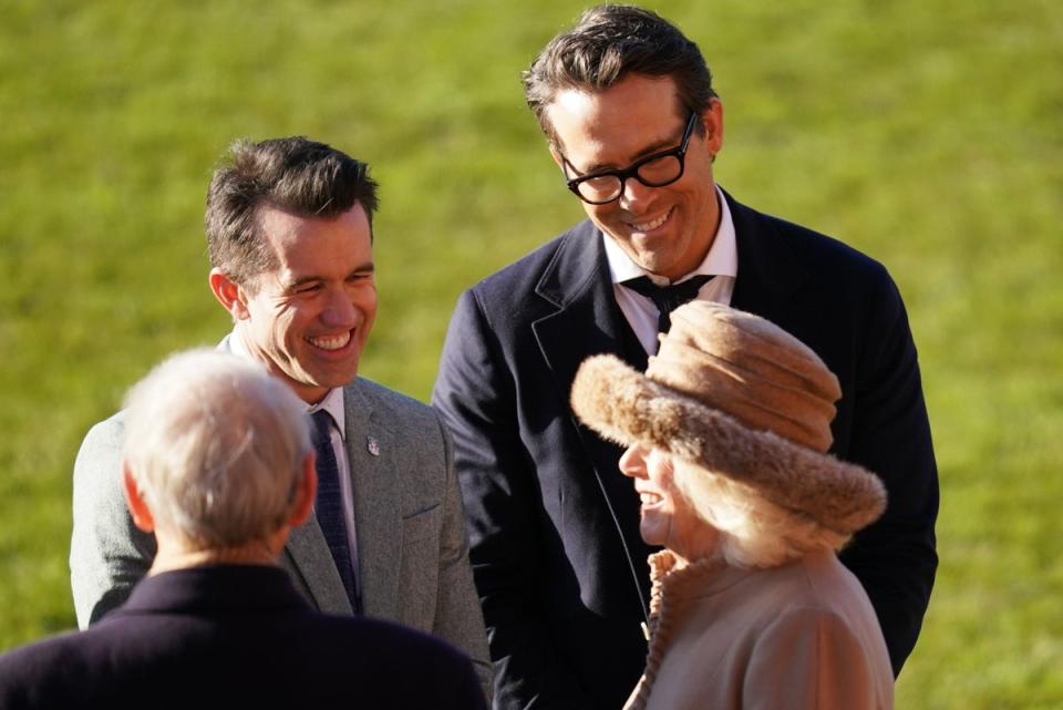 Ryan Reynolds (top right) and Rob McElhenney (top left), pictured with the Queen Consort and King Charles III at Wrexham Association Football Club's Racecourse Ground, will also be headlining at the Just For Laughs festival (PA)