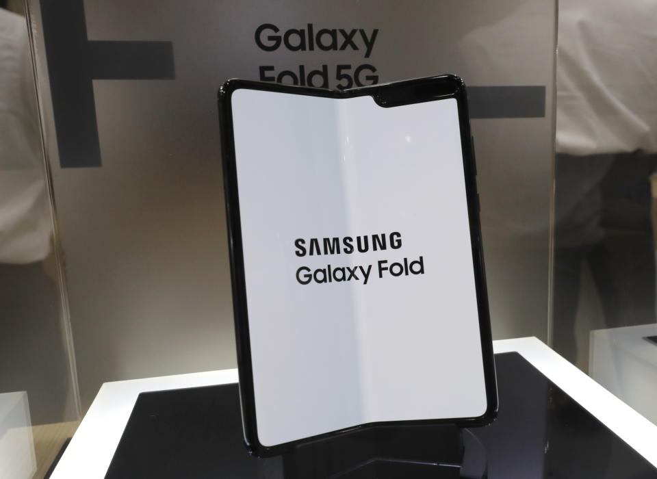 Samsung Electronics Co.'s Galaxy Fold is displayed at Korea Electronics Show in Seoul, South Korea, Tuesday, Oct. 8, 2019. Samsung Electronics has predicted its operating profit for the last quarter will fall by more than 56% from a year earlier amid sluggish global demand for computer chips. (AP Photo/Lee Jin-man)