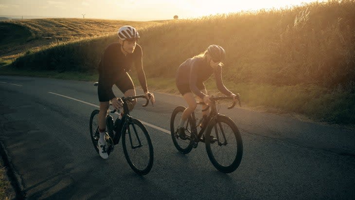 Two people are cycling at altitude