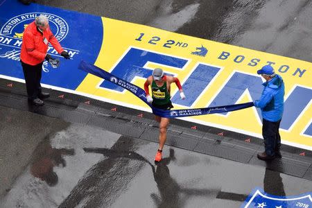 Apr 16, 2018; Boston, MA, USA; Yuki Kawauchi crosses the finish line of the 2018 Boston Marathon winning the men's division. Mandatory Credit: Brian Fluharty-USA TODAY Sports