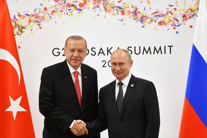 FILE PHOTO: Russian President Putin and Turkish President Erdogan attend their bilateral meeting on the sidelines of the G20 leaders summit in Osaka