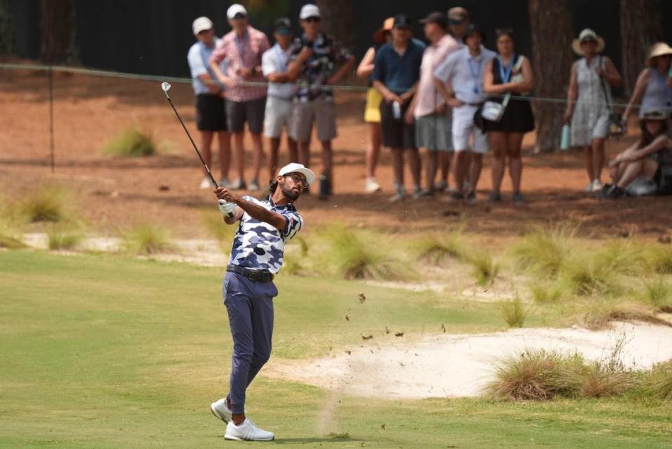 Akshay Bhatia hits from the first fairway during the final round of the U.S. Open golf tournament.