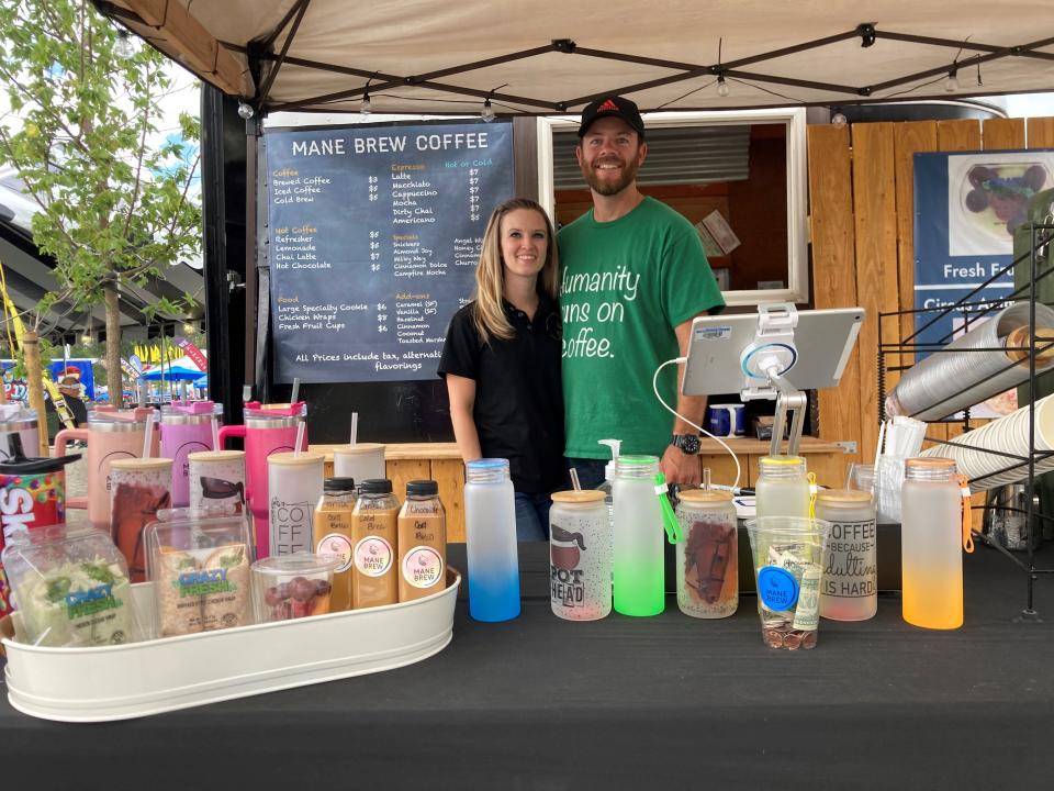 Rachel and Joshua Rogers in front of their booth for Mane Brew Coffee at the Colorado State Fairgrounds on August 28, 2023. The coffee booth doesn't charge extra for non-dairy milk.