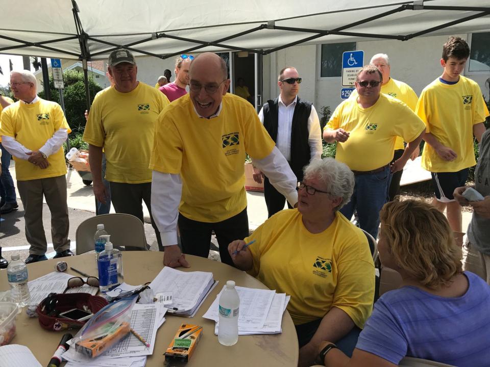 President Henry B. Eyring, second counselor in the First Presidency of the Church, extended the love and support of Church Caribbean and Florida following Hurricane Irma. He is wearing the familiar yellow Helping Hands shirt on Saturday, September 16, 2017. | Intellectual Reserve, Inc.